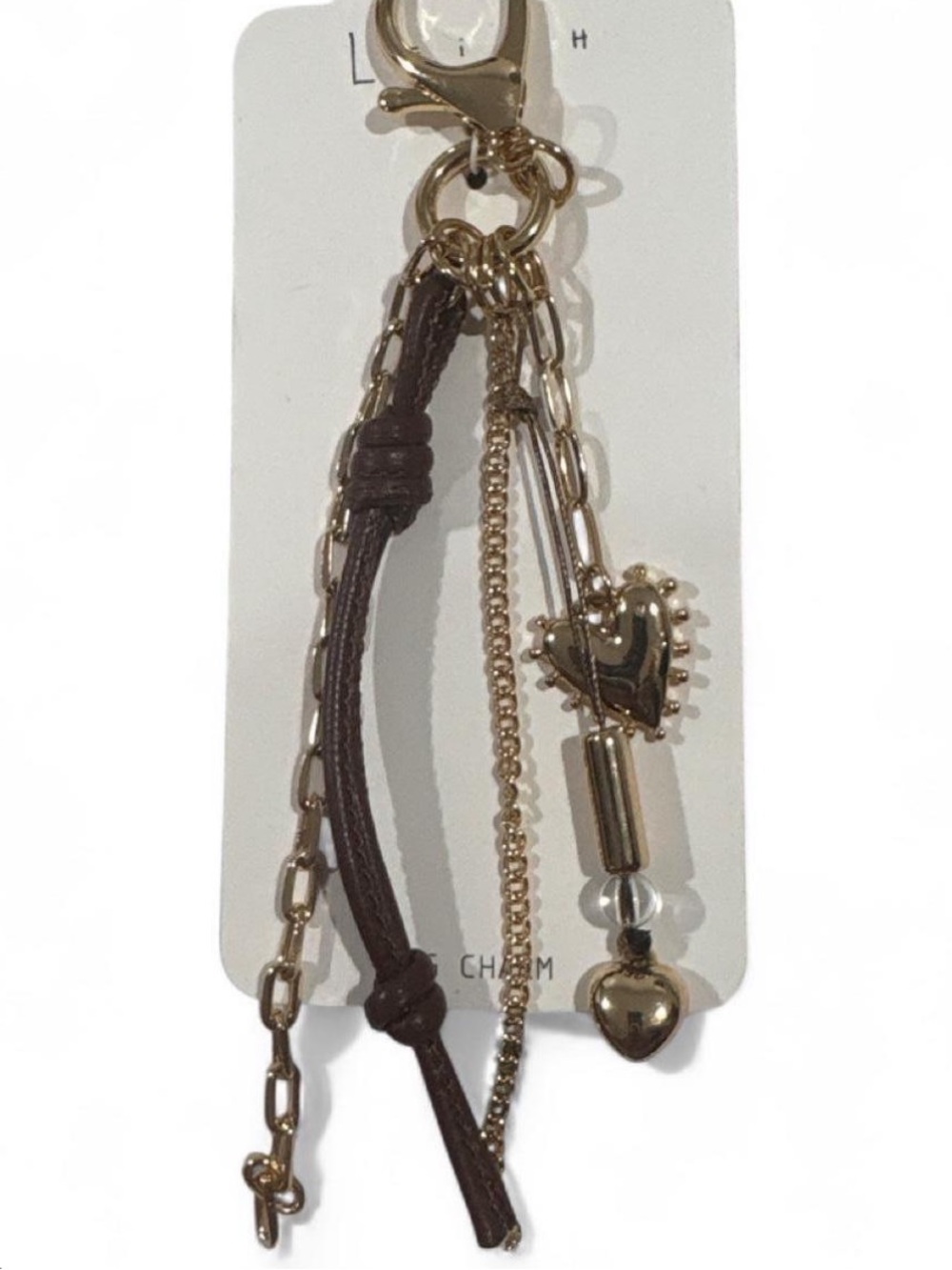 Leith brown & gold bag charm with heart charm and chain